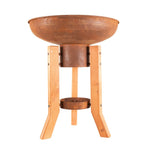 Bain d’oiseau en cuivre rustique avec pieds en bois clair et une base circulaire assortie