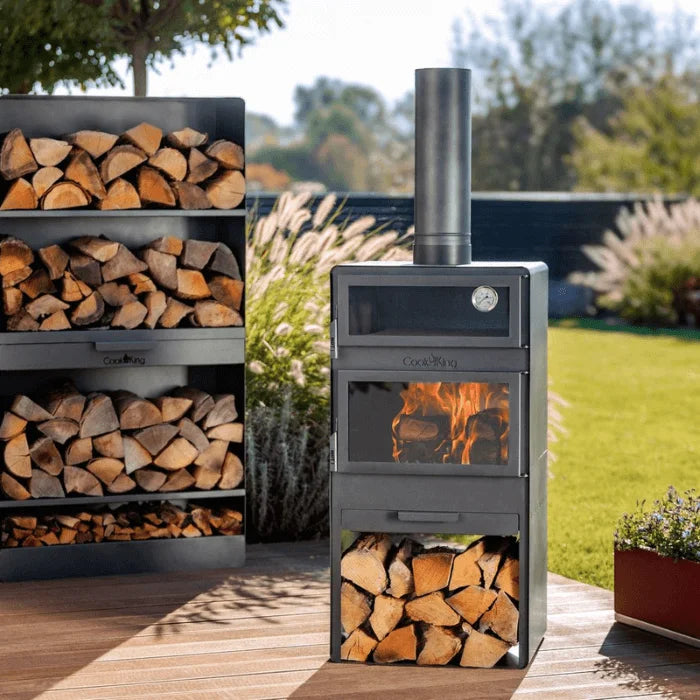 Brasero acier noir VENTO avec feu visible, bûches et cheminée