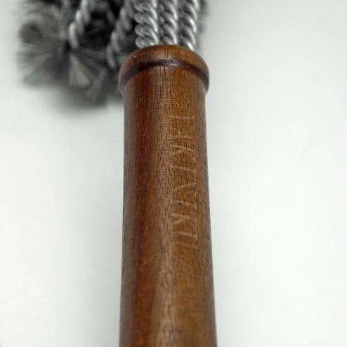 Poignée de corde à sauter en cuir marron avec corde argentée et pompons noirs