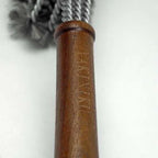 Poignée de corde à sauter en cuir marron avec corde argentée et pompons noirs
