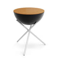 Table d’appoint ronde noire et bois avec pieds en métal.