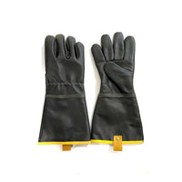 Gants de soudure en cuir noir avec accents jaunes et fermeture à velcro.