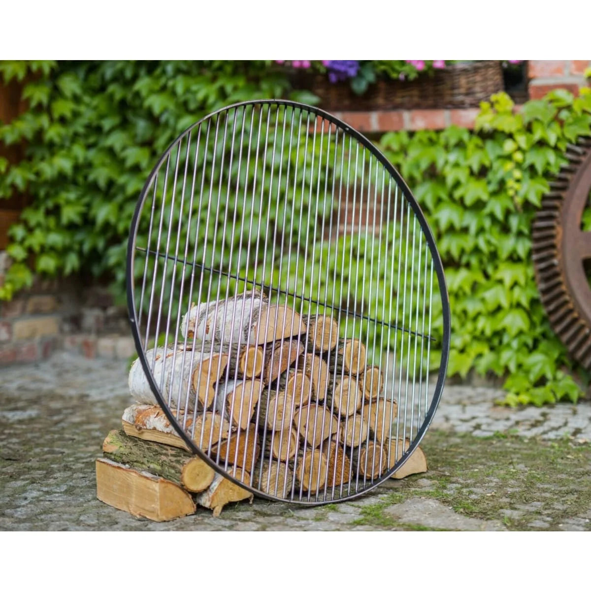Grille de cuisson acier noir Ø60 cm ronde avec bûches empilées