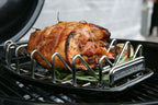 Grille de rôtissage en acier inoxydable avec marque ’outdoorchef’, conçue pour griller ou cuire au four.