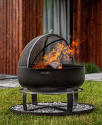 Foyer de feu noir avec écran en maille et support, utilisation extérieure.