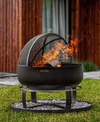 Foyer de feu noir avec écran en maille et support, utilisation extérieure.