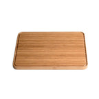 Planche à découper en bambou avec veinage et bords en bois naturel.