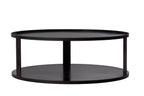 Table basse ronde noire avec deux étagères et un design minimaliste.