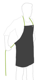 Tablier noir avec bordure vert citron et sangle de cou réglable.