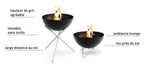 Foyer d’incendie noir avec des pieds en acier inoxydable et un design moderne, adapté à une utilisation en extérieur.